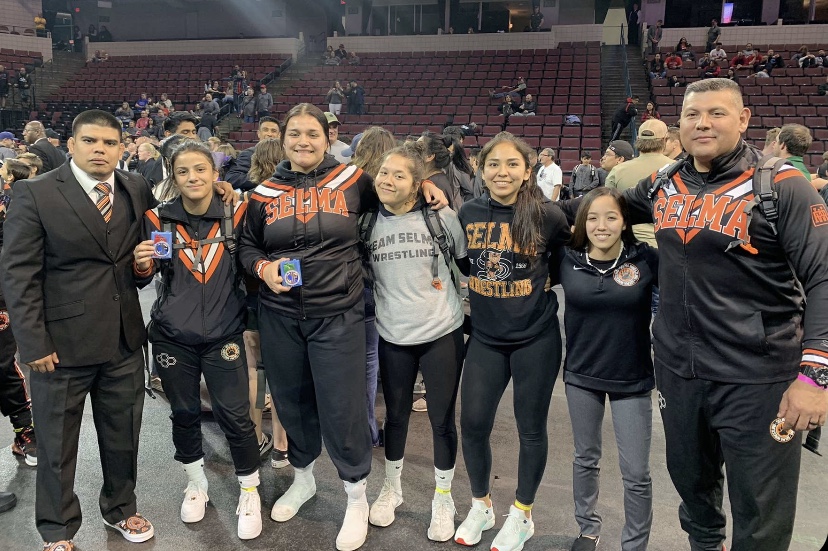 Left to Right: Coach Jose Mendoza, senior Melanie Mendoza, juniors Arykah Cuevas, Mariah Valdez, Vanessa Mares, and Coach Ernie Estrada pose for a picture after successful matches at the state championships. 
Photo Contributed by Vanessa Mares