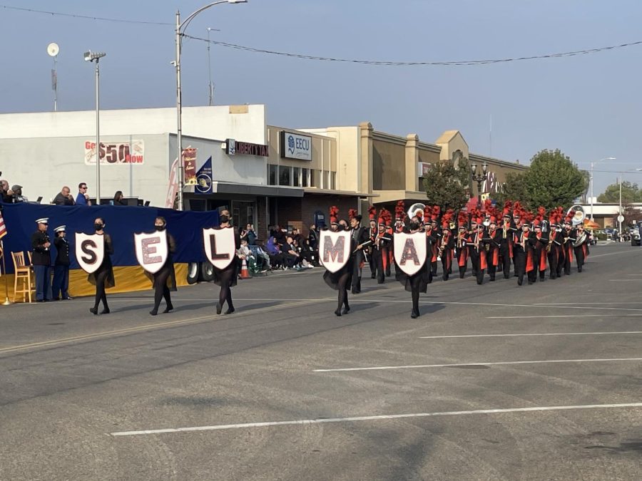 Selma High marching band colorguard step out, ready for performance. 