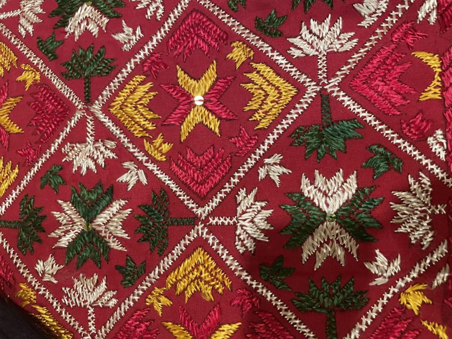 Above is a Phulkari—pronounced full kari. Phulkari means flower craft and is the rural embroidery design of Punjab. Women often adorn themselves with different phulkari(a) and typically wear them as shawls draped over the head on special occasions, such as marriages, and other events. 