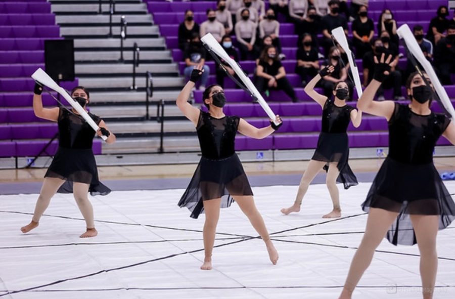 The winter guard team performing their piece, “Sonder,” at their competition at Mission Oak High.
