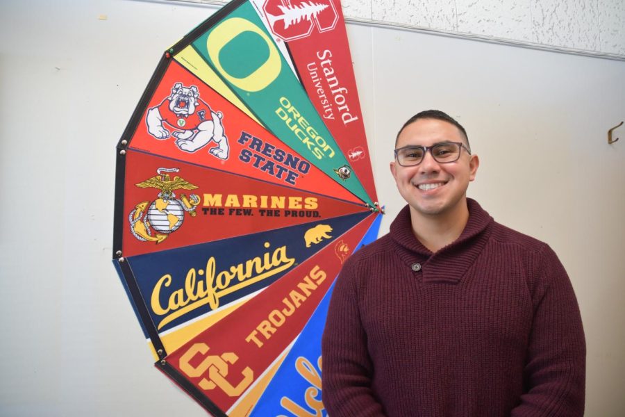 Mr. Galindo recognizes the flags of the various schools he hopes his students will attend.

