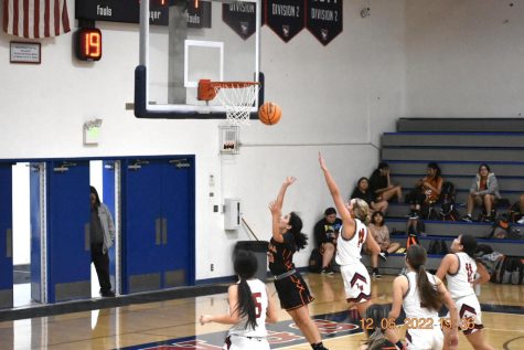 Freshman Isabella Gonzalez going up for a lay-up
