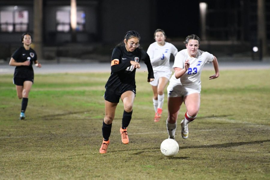 Makaira Chavez rushes through defenders from Immanuel High.