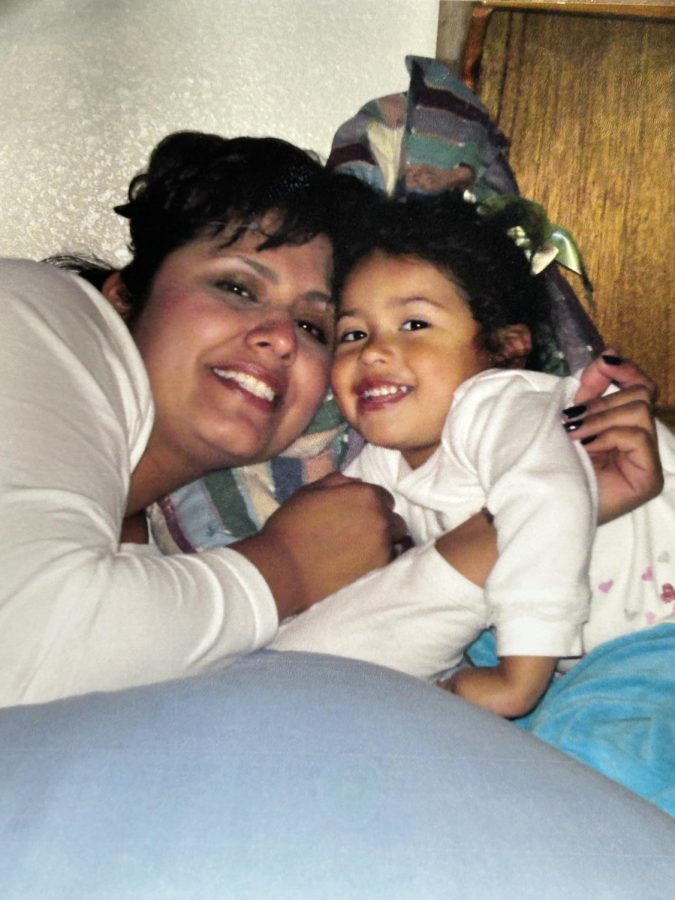 Susana Zamora and her daughter resting together.