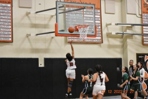 Avnique Gill going up for a lay-up.