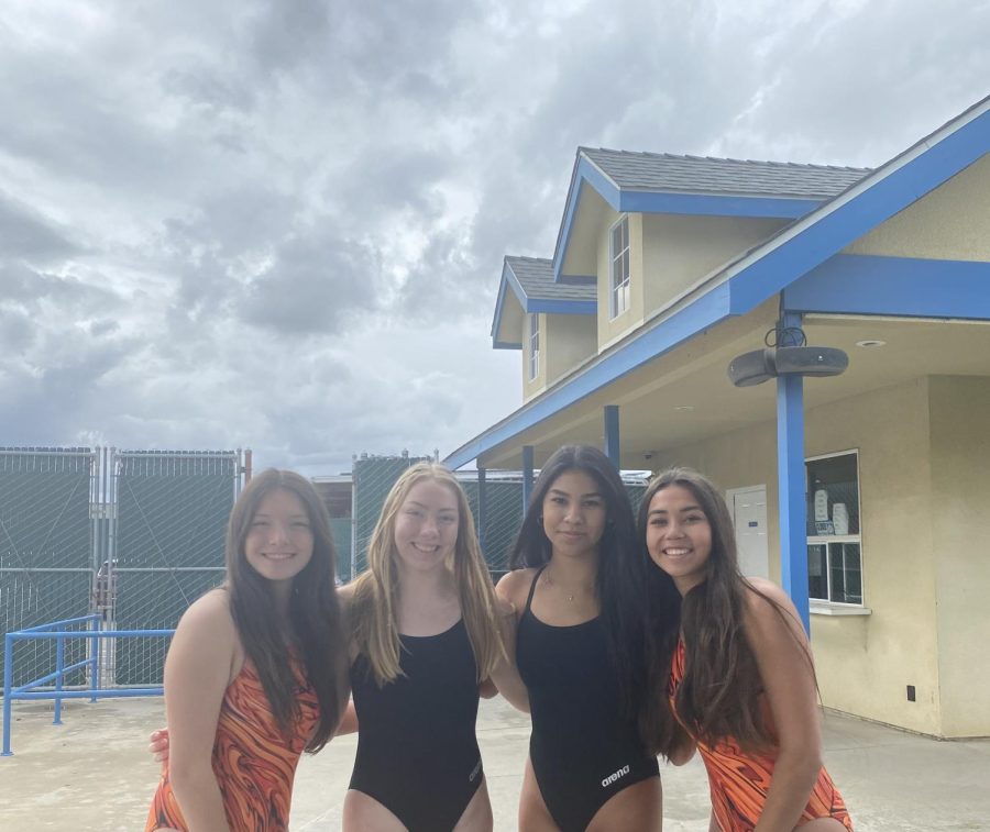 Selma High Swim teammates smiles for a picture.