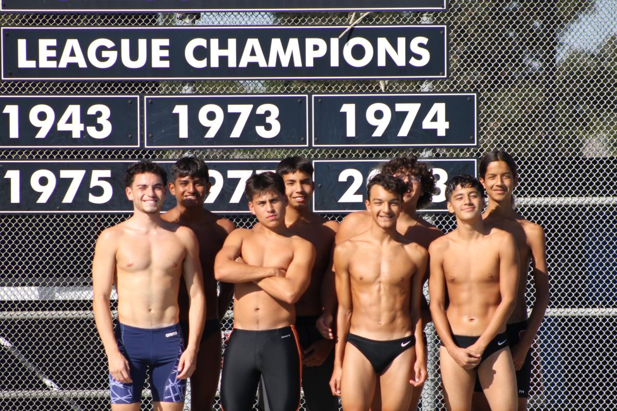 The Boys’ Varsity Water Polo team pose for a picture. 
