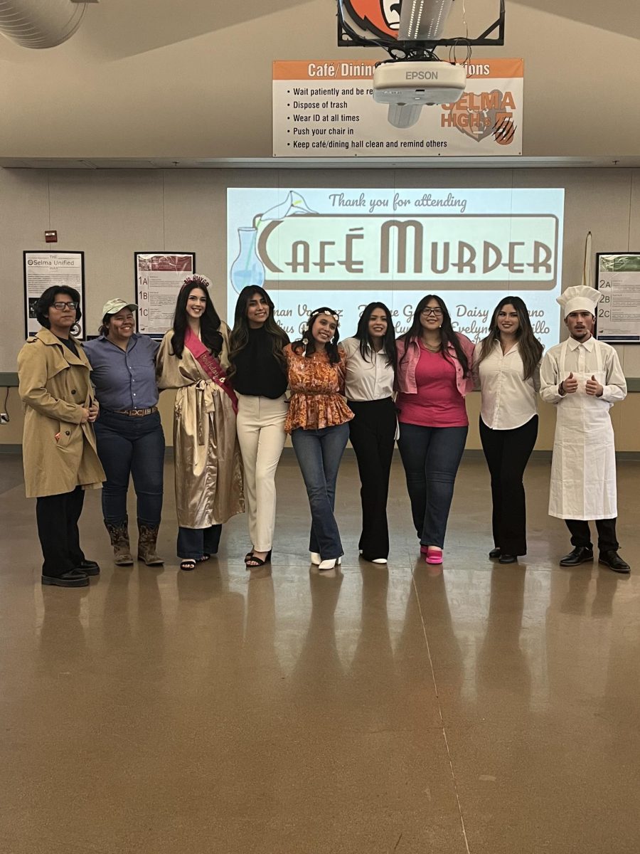 The cast of Cafe Murder pose for a picture