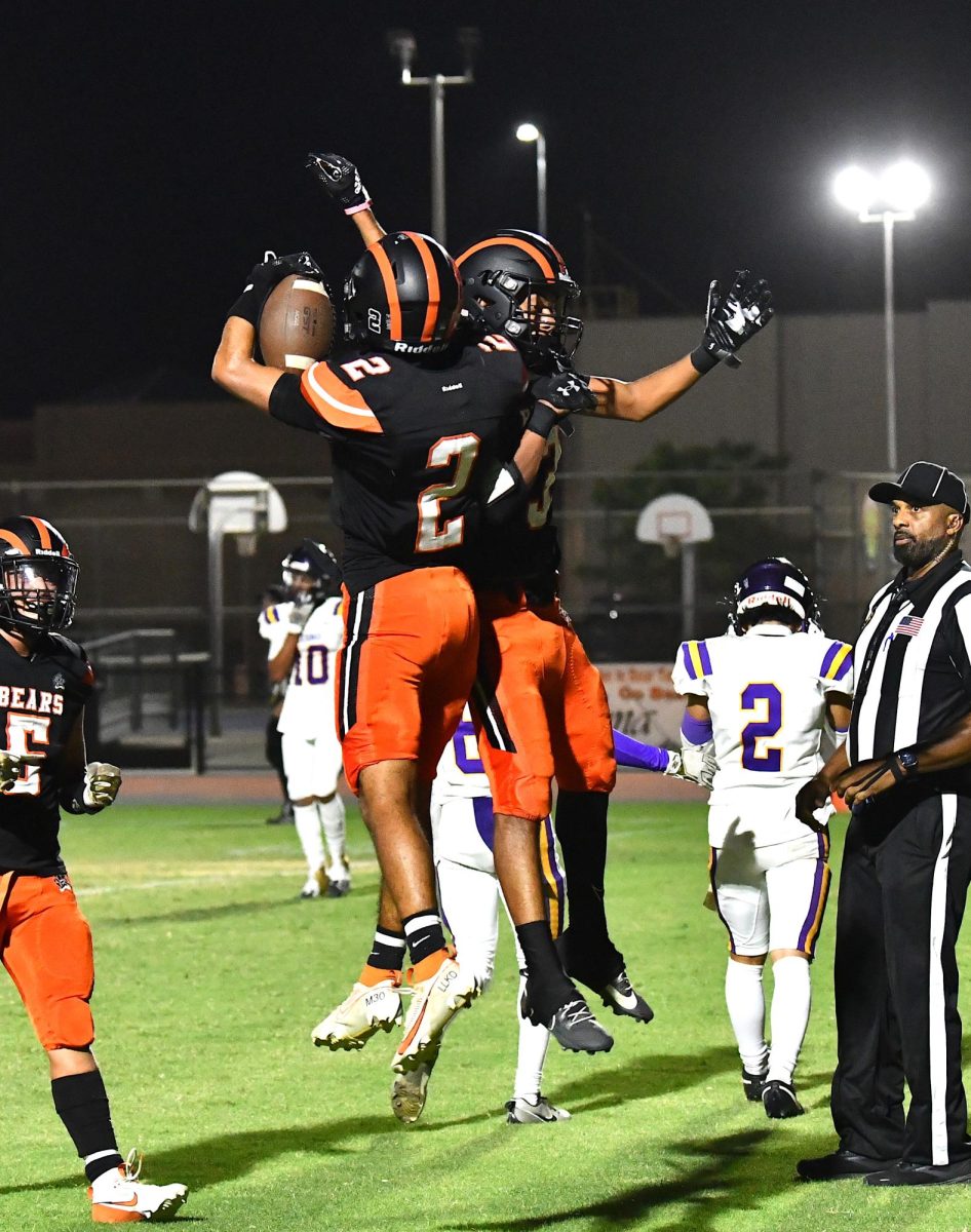 Jordan Alvarado and Irvin Prieto celebrate a touchdown against Cabrillo High