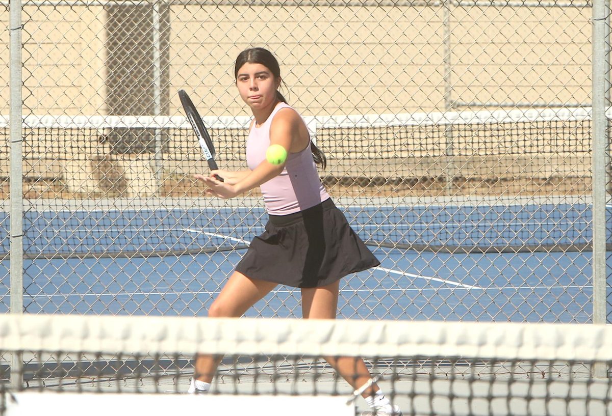 Mia Balderas, a senior in a leadership position on the tennis team, playing in the Alberto Perez Memorial Tennis Tournament over the weekend. 