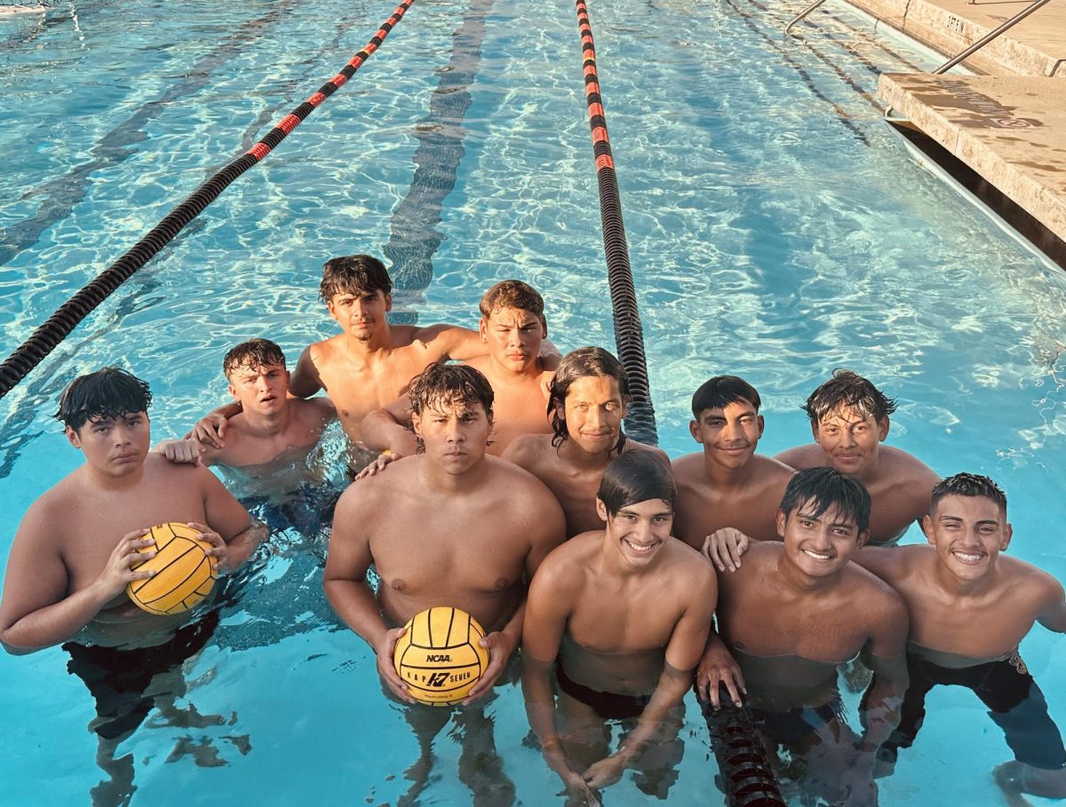 Boys Water Polo poses for a picture at Senior Night