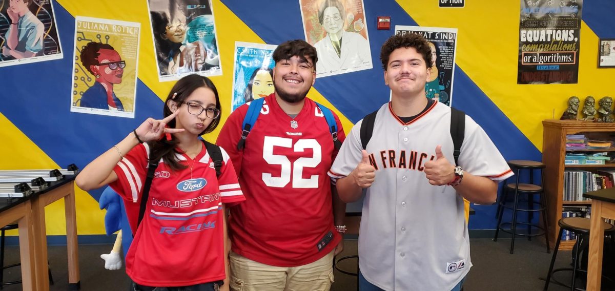 Seniors (from left to right), Jackie Aguilera, Donovan Contreras and Brayden Brumm, wearing jerseys for Wednesday’s theme, “Sports Day.” 