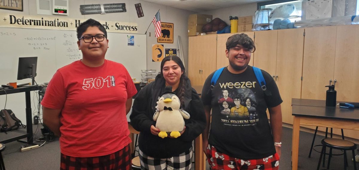 From left to right: John Camarillo (senior), Kim Torres (senior) and Donovan Contreras (senior) stand in their pajamas, celebrating the first event of the Red Ribbon Week dress up days. 