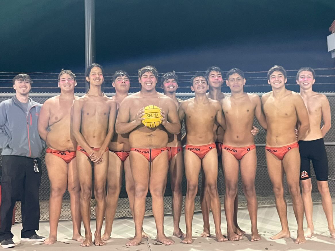 Boys Water Polo poses for a picture at Senior Night