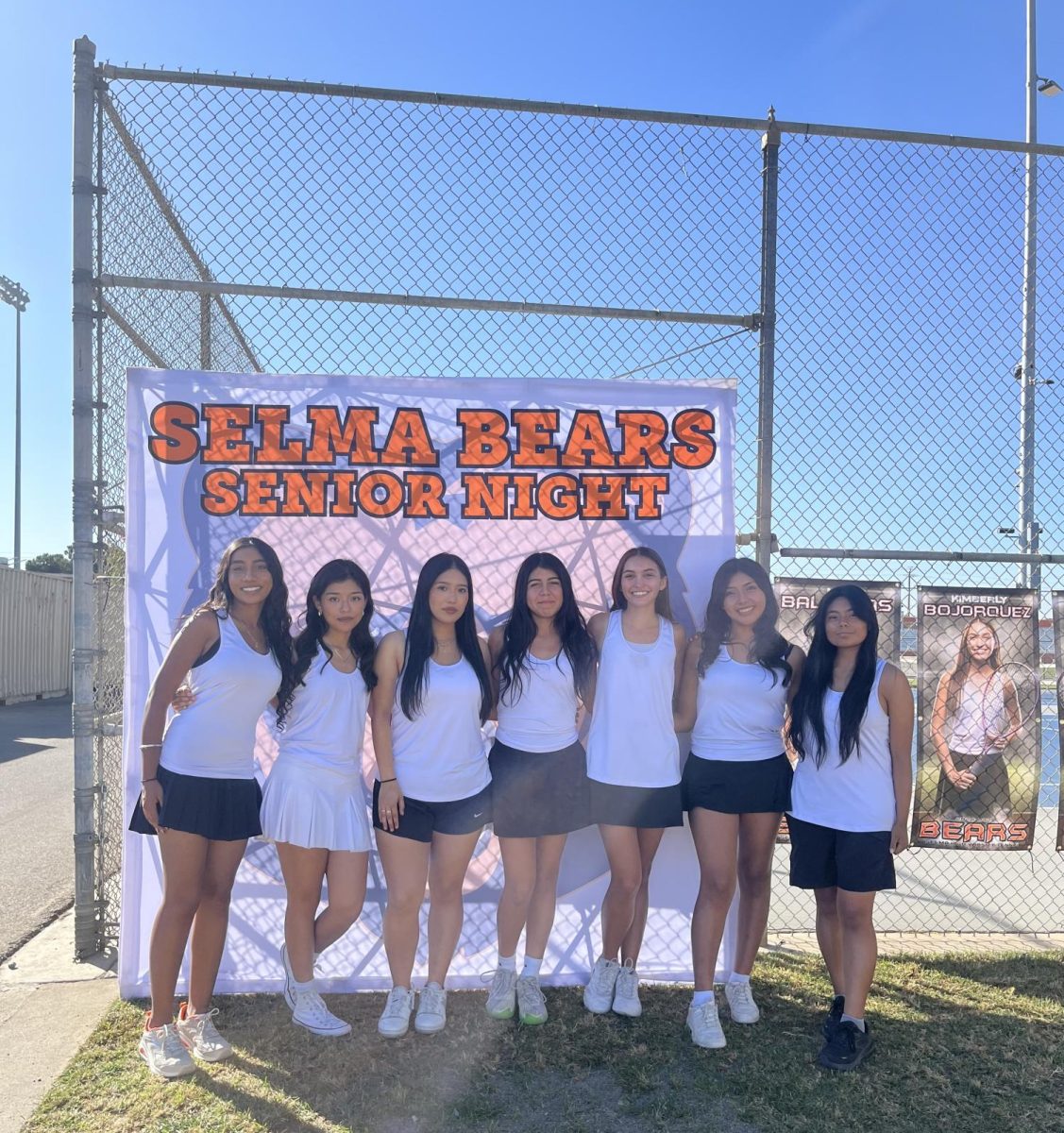 Seniors on the girls’ tennis team gathered together for a photo at their senior night.