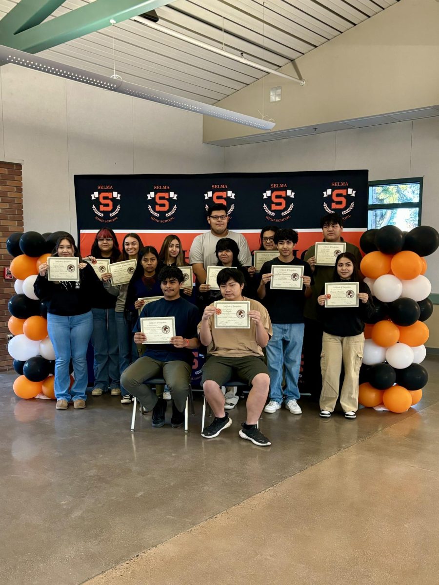 Students awarded at the Core Four ceremony proudly show their certificates. 
Photo Credit: @wedem_bears on Instagram
