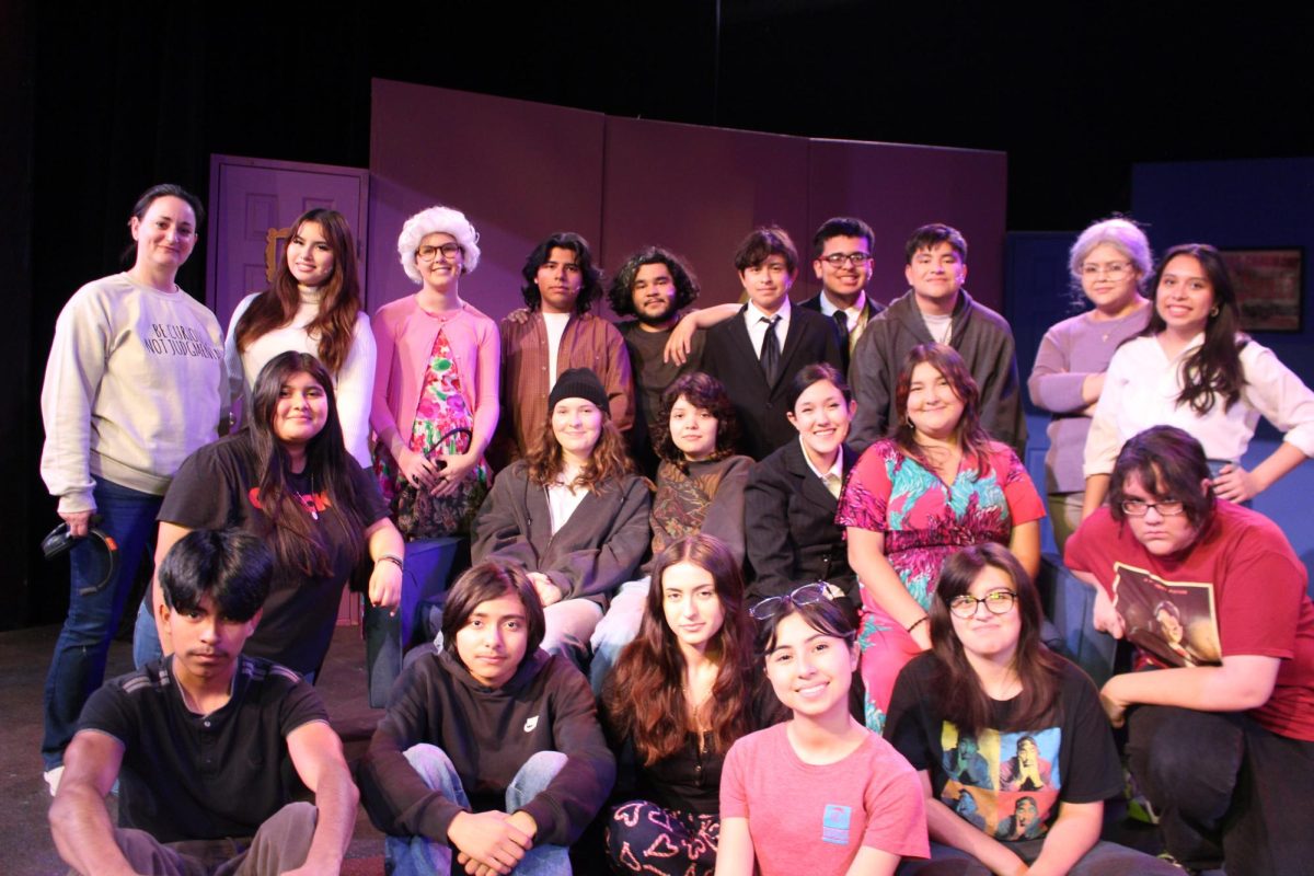 The cast from "Make Em Laugh” huddled together after their final rehearsal right before going onto stage.