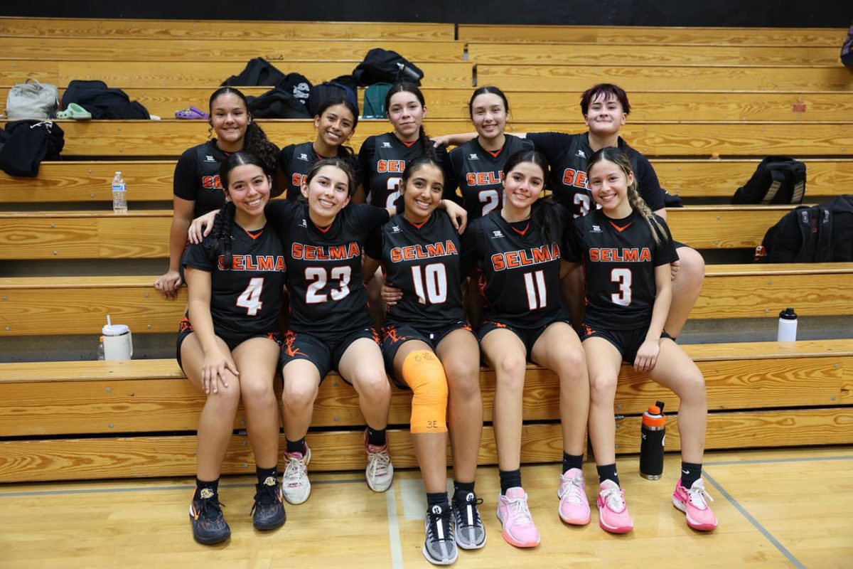 The girls basketball team huddled together after a long game night.