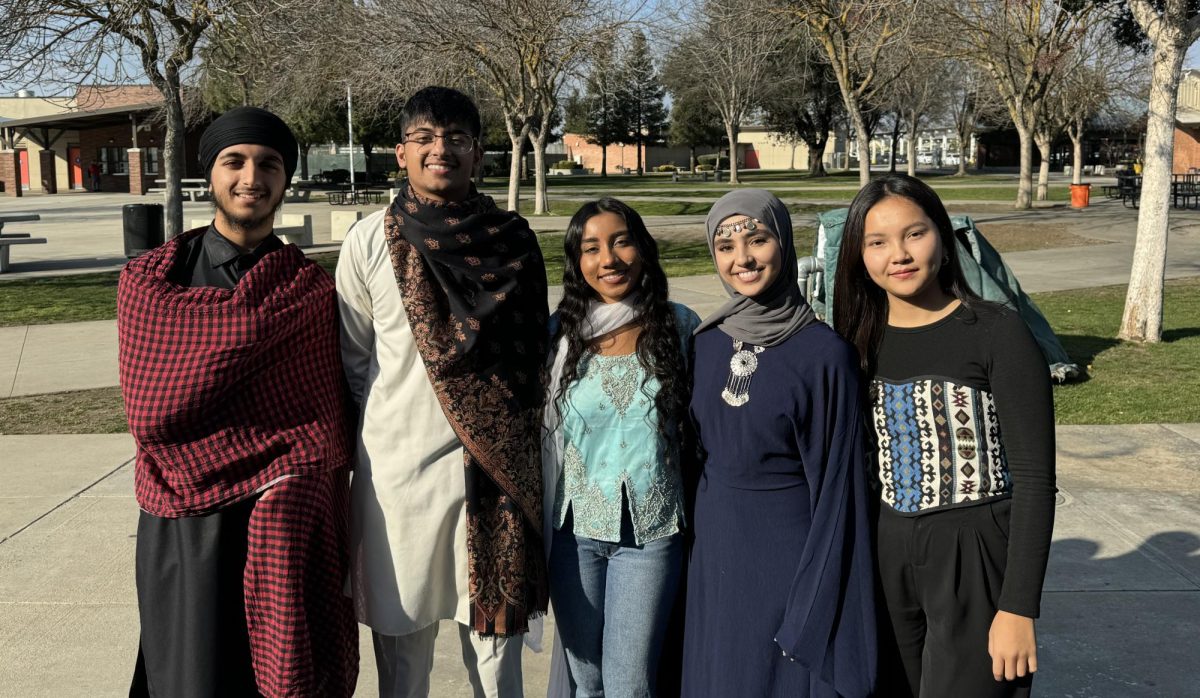 From left to right: Prabhjot Singh, Jhosh Binning, Jasleen Ganger, Yossra Saad, Malika Basylbekova, wear clothing that represents their cultures. Photo by Joaquin Marquez