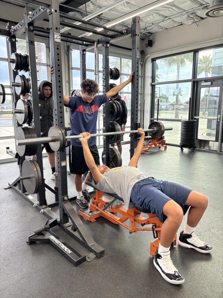 Shawn Valdez and Andrew Bustinza in the SHS weightroom for swim practice. Photo by Kimberly Bojorquez