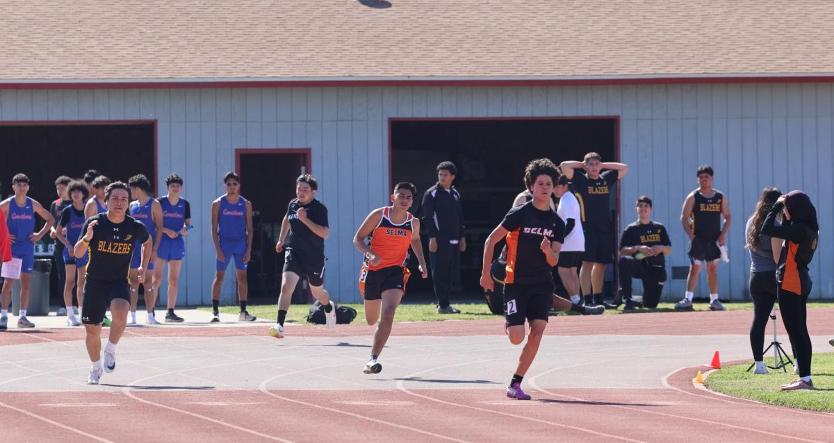 Joan Bolanos and Devin Chavez racing the 200m at the Redcats Relay track meet.