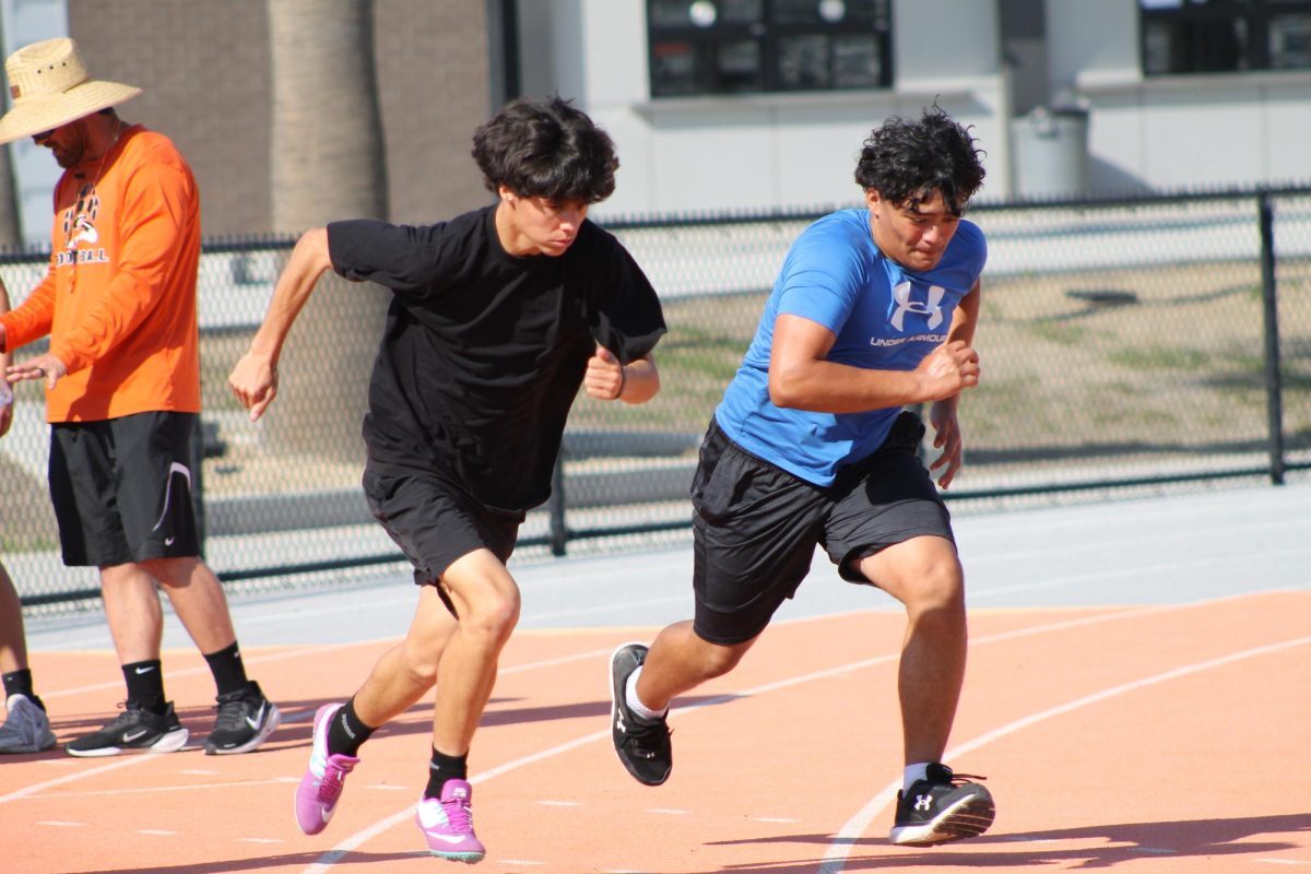 Senior Devin Chavez and Freshmen Andreas Luna practicing for their next track meet. Photo by Gurleen Kaur