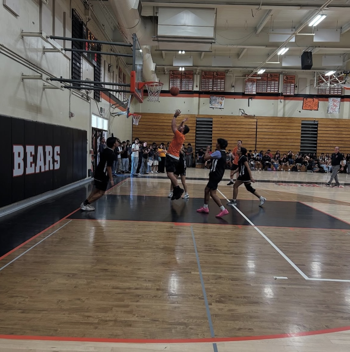 Coach Francis making a shot against the students. 