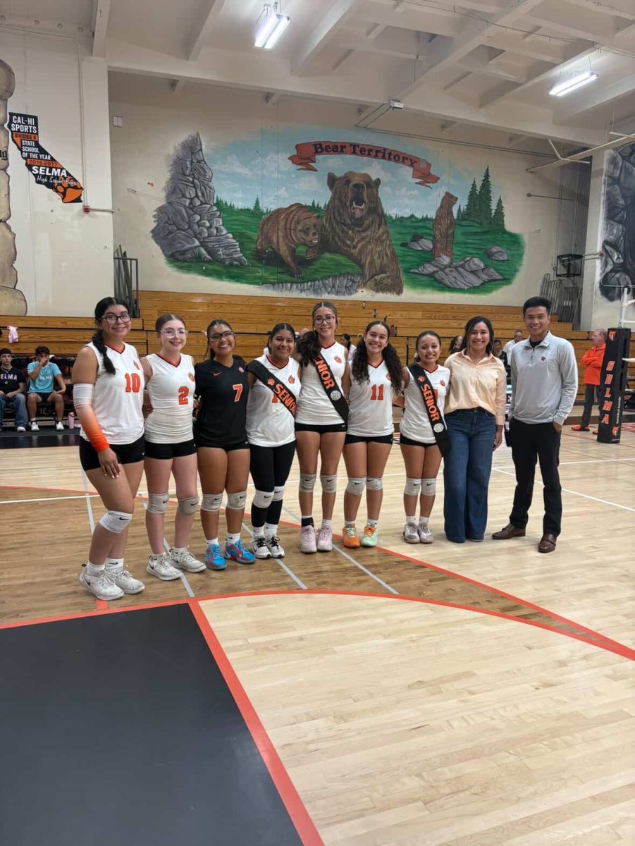 The senior volleyball girls gather for one last time with Coach Caylin Lopez and Mr. Ly.