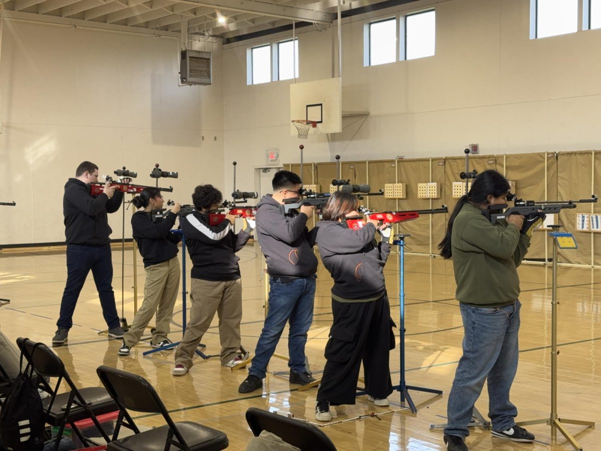 SHS MCJROTC marksmanship taking shots while standing.