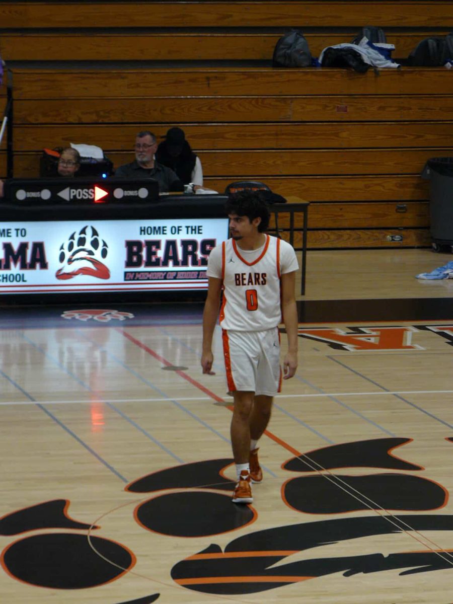 Junior Abram Arcos scans the court, waiting for the next play. 