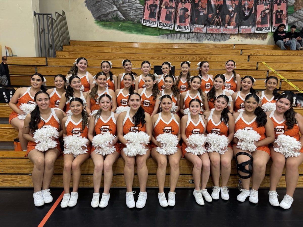 Varsity Cheerleaders prepared for their game against Kerman.