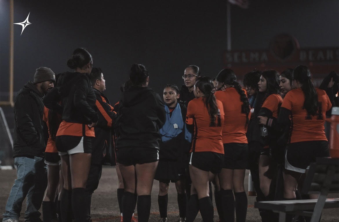 The Bears embrace after securing a win against Lindsey. 