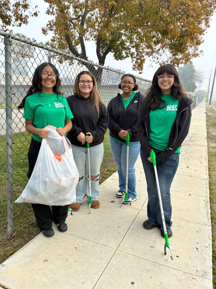 Members of Clean Up Selma show off the garbage they collected.