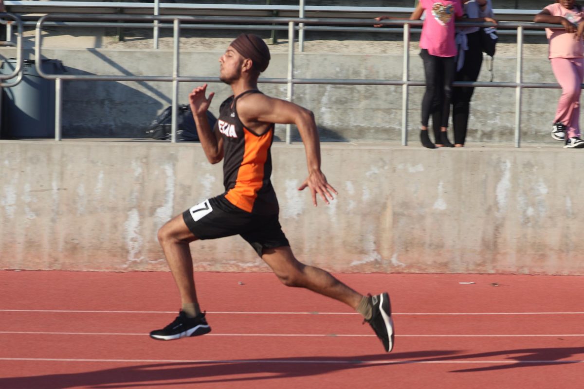 Senior Rajbir Singh runs at the Dinuba Track Meet. 