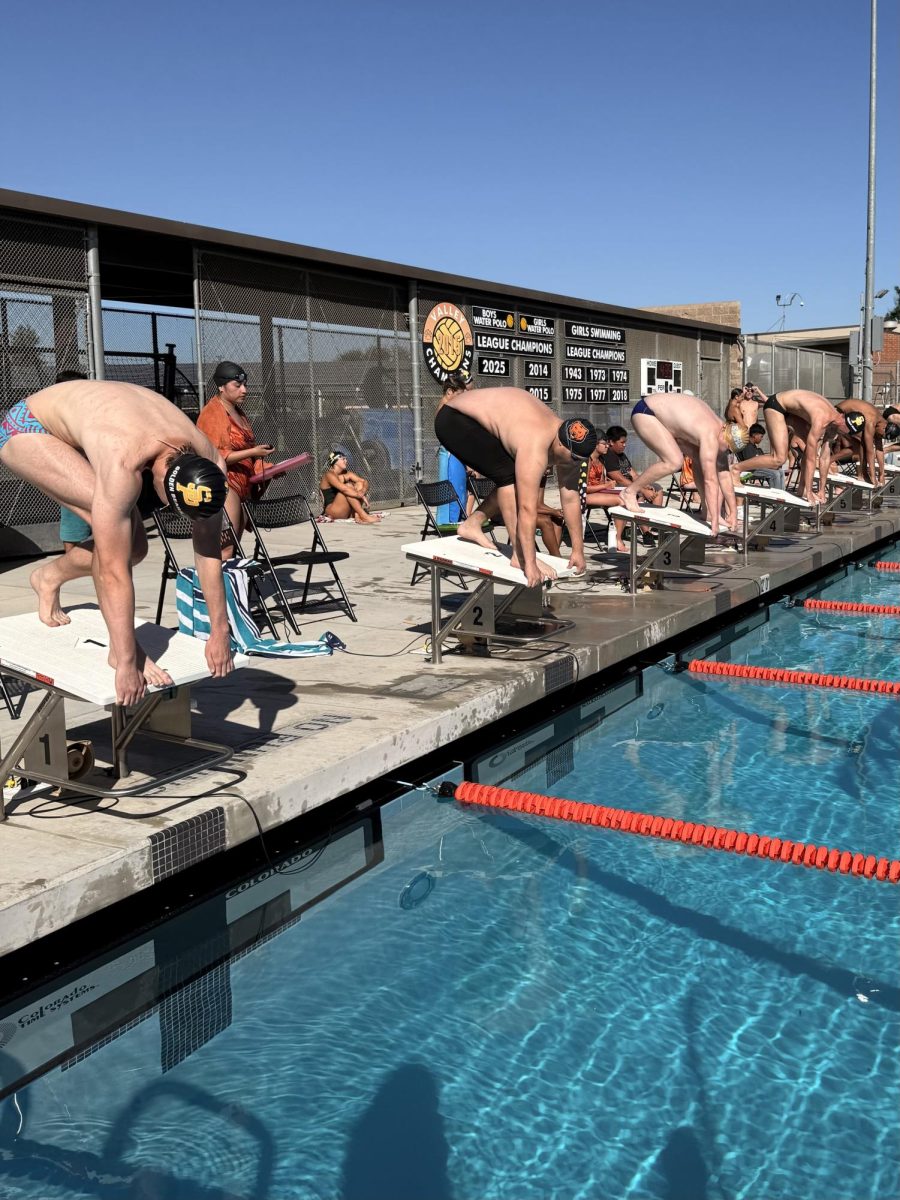 SHS swimmers taking on Exeter and Sierra Pacific.